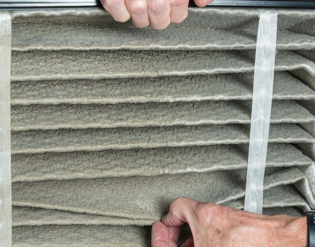 Dirty, clogged HVAC air filter needing replacement.