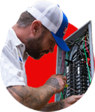 Electrician working on electrical panel, troubleshooting wiring.